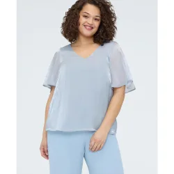 Blusa de mujer textura metalizada con puntos de luz