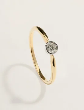 Anillo solitario bicolor de 18k con diamante talla brillante de 0,10ct - El Corte Inglés - FashionsVida