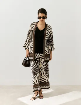 Pantalón fluido de mujer con estampado y negro - Couchel - FashionsVida
