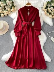 A long skirt with satin collar design cinched waist and wide swing