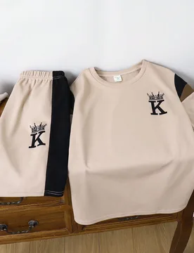Set de 2 piezas con camiseta de cuello redondo de manga corta con estampado de color en contraste y pantalón corto de cintura elástica, versátil y - Shein - FashionsVida
