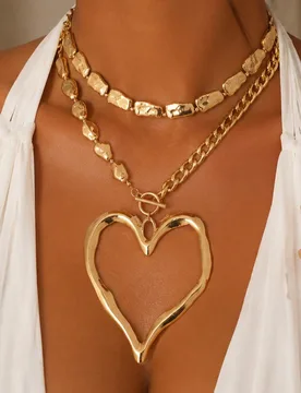 Set de 2 collares con colgante de corazón hueco, color dorado, de cuentas hechas a mano de CCB, collar gargantilla multicapa, adecuado para uso diari - Shein - FashionsVida