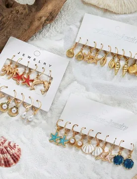 Set de 5/6/16 piezas de pendientes con combinación de estrellas de mar, conchas, caracolas y otras formas de vida marina con estilo de océano verani - Shein - FashionsVida