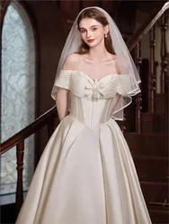 A one-shoulder white satin light new Hepburn style dress