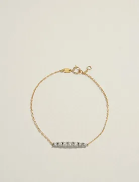 Pulsera bicolor de 18k con diamantes en talla brillante con un peso total de 0,35ct - El Corte Inglés - FashionsVida