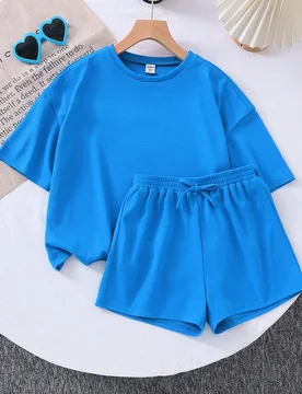 Conjunto casual de top de manga corta de ajuste suelto de unicolor y shorts para niña preadolescente LMoss - Shein - FashionsVida
