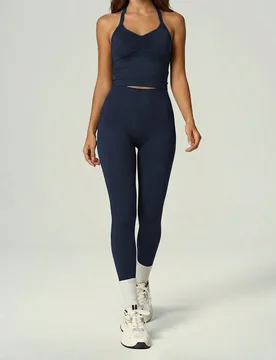 Conjunto deportivo para mujer con sujetador deportivo de cuello halter, escote en V y fruncido delantero, y leggings de cintura alta con control de ab - Shein - FashionsVida