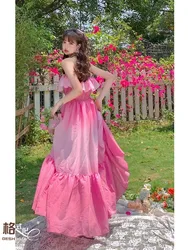 A unique strapless dress with pink gradient and one-shoulder ruffled edges