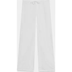 Pantalón liso de mujer con bordado suizo