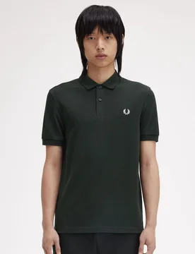 Polo de hombre liso de manga corta en piqué de algodón - Fred Perry - FashionsVida