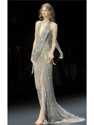 A long dress with deep sequined neckline that exudes elegance and charm for the host