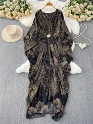 An elegant irregularly shaped long dress with ethnic style printed sleeves and a cinched waist
