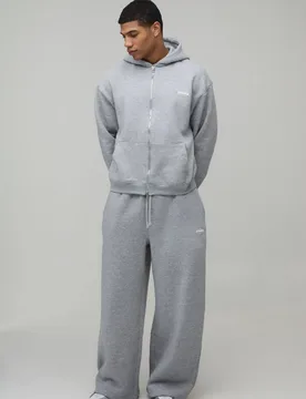 Herren Oversized Boxy Herren Sport Kapuzen-Trainingsanzug mit Reißverschluss und weiten Beinen Grey Marl Größe Small - boohooMAN - FashionsVida