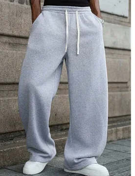 Par de pantalones deportivos largos holgados de moda para hombre, diseño minimalista de unicolor con pierna ancha, cintura con cordón, bolsillos gra - Shein - FashionsVida