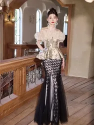 A black fashionable design dress for adult hosts with halter-neck one-shoulder and fishtail