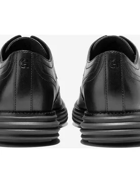 Zapato oxford de hombre confeccionado en piel con detalles brogue clásicos - Cole Haan - FashionsVida
