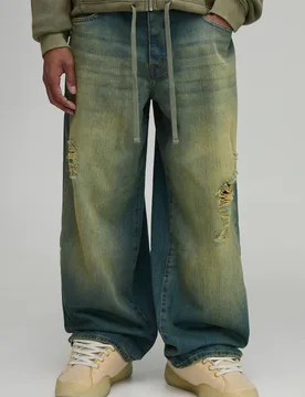 Herren Jeans Hosen Mit Verstellbarem Bund, Getönt, Zerrissen, Super Weit Geschnitten Mid Blue Größe 32R - boohooMAN - FashionsVida