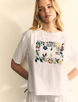 Camiseta de mujer con espalda con cruce con logo delantero con flores - Hannibal Laguna Collection - FashionsVida