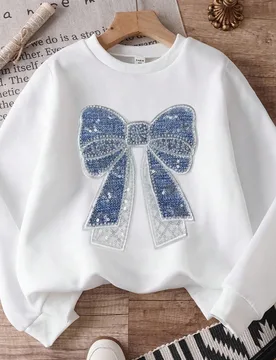 Sudadera de cuello redondo dulce y casual para niñas mayores, top de manga larga blanco con estampado gráfico de lazo grande con efecto de lentejuel - Shein - FashionsVida