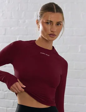 Top corto de manga larga de activewear con agujero para el pulgar, ideal para pádel, tenis, pickleball y gimnasio en invierno - Shein - FashionsVida