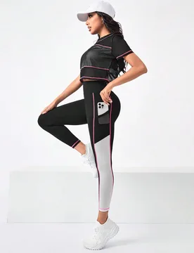 Conjunto de ropa deportiva para mujer con camiseta de bloques de color y mallas con bolsillo de teléfono a los lados - Shein - FashionsVida