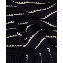 Top de punto de mujer sin mangas con peplum acampanado