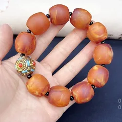 Nepal paired with frosted barrel beads , old , orange-red amber drum bead bracelet for