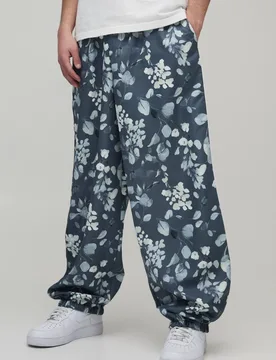Herren Parachute Fit Hose mit Blumendruck aus Nylon Grey Größe Large - boohooMAN - FashionsVida