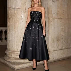 Black satin strapless sleeveless A-line ankle-length formal evening dress with metallic embellishments