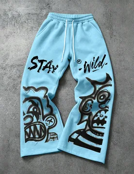 Pantalones de chándal de pierna ancha estilo Y2K azul cielo claro para hombre, estampado de monstruo de grafiti abstracto gótico, ropa de calle con - Shein - FashionsVida