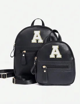 Pieza Mochila clásica para niñas con 26 letras A-Z, bolso de hombro, billetera con forma de corazón, correa de hombro ajustable, ideal como regalo - Shein - FashionsVida